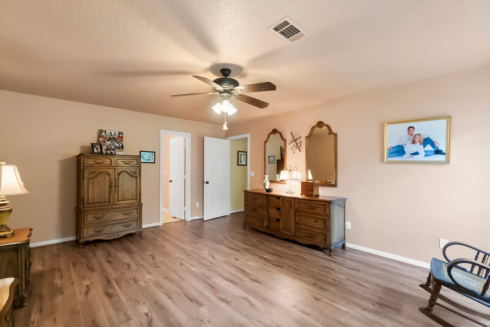 292 Apple Valley Drive Conroe, TX 77304 - Photo 22 of 40 a view of a kitchen with a sink cabinets and wooden floor