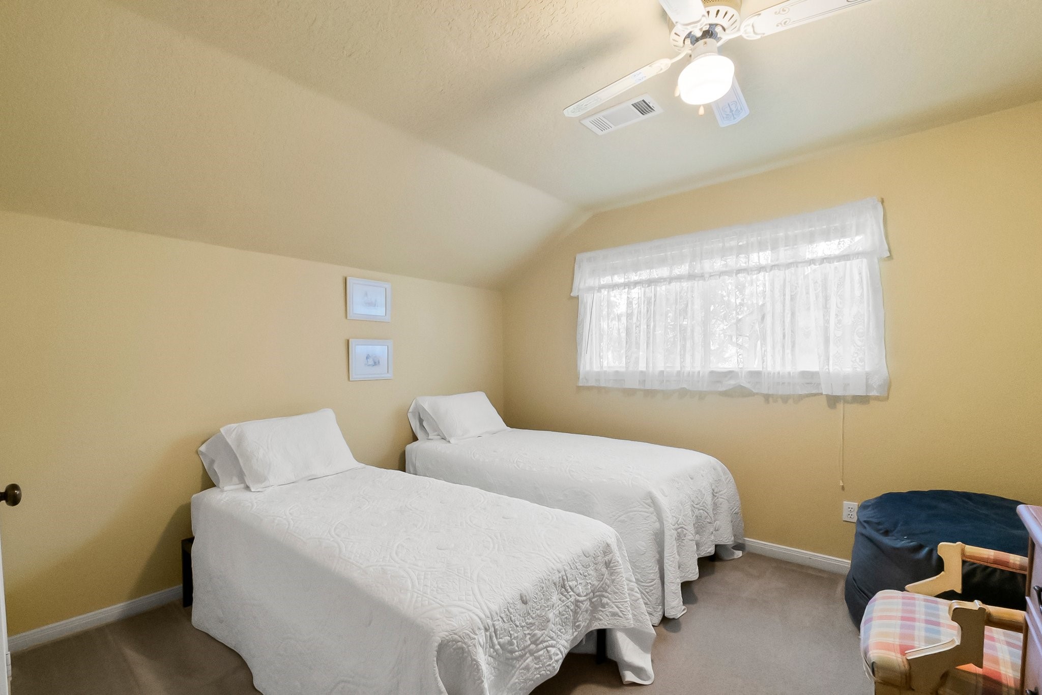 292 Apple Valley Drive Conroe, TX 77304 - Photo 29 of 40 a bedroom with bed and a window