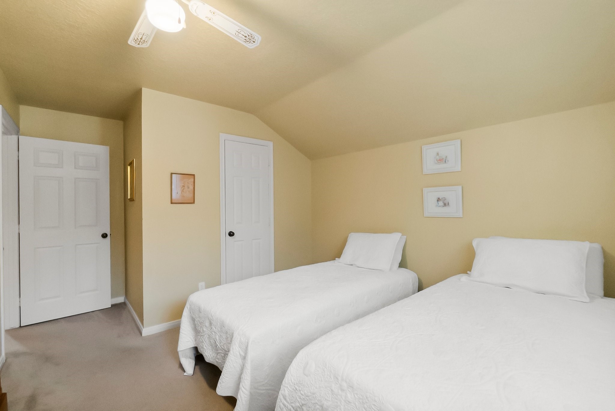 292 Apple Valley Drive Conroe, TX 77304 - Photo 30 of 40 a bedroom with a bed and a chandelier