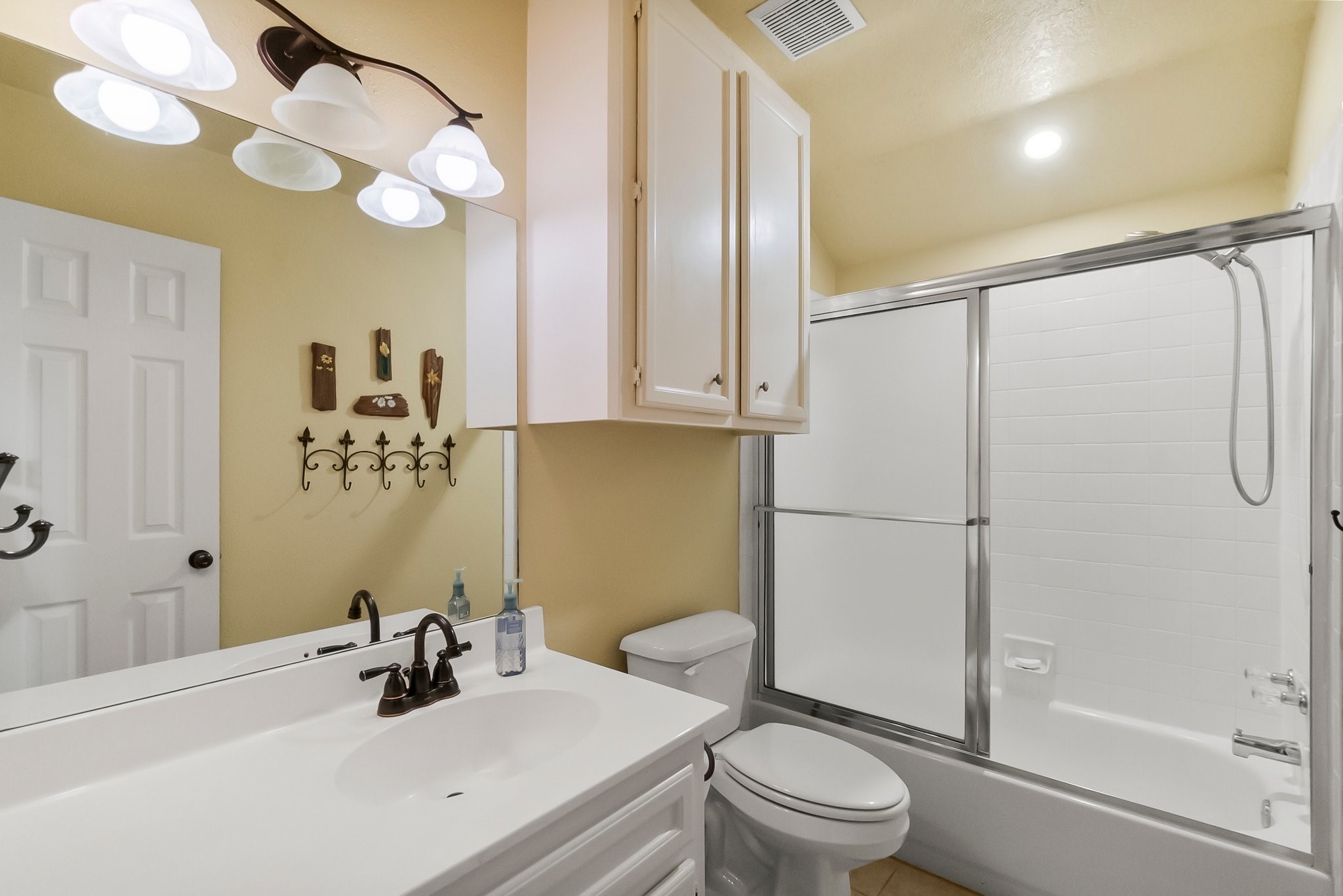 292 Apple Valley Drive Conroe, TX 77304 - Photo 33 of 40 a bathroom with a sink a toilet and shower