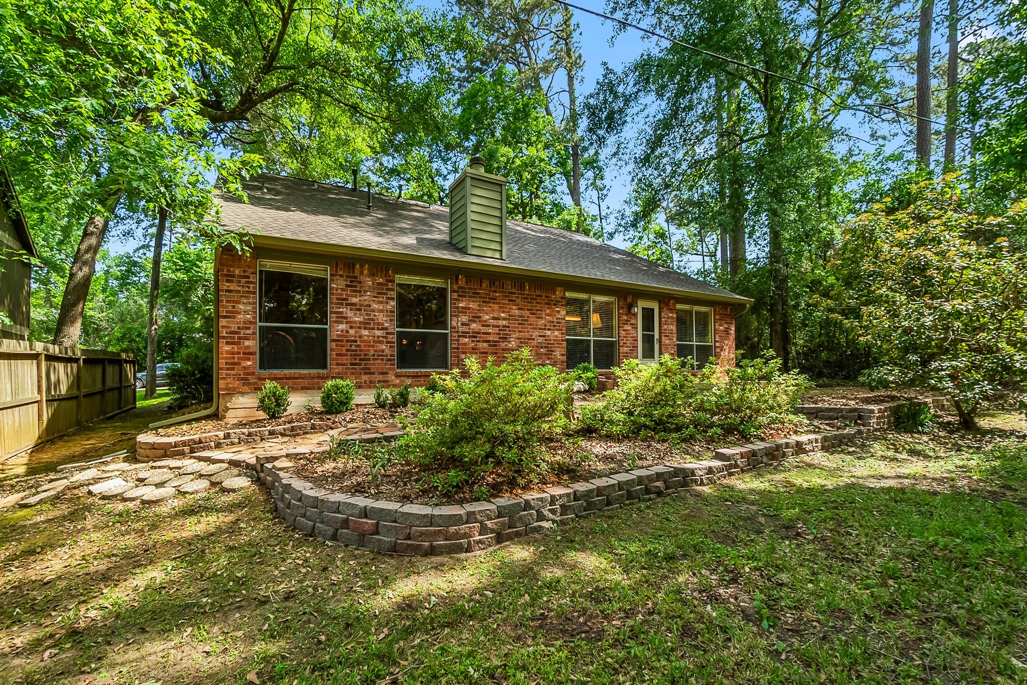 292 Apple Valley Drive Conroe, TX 77304 - Photo 39 of 40 a view of a house with pool and garden