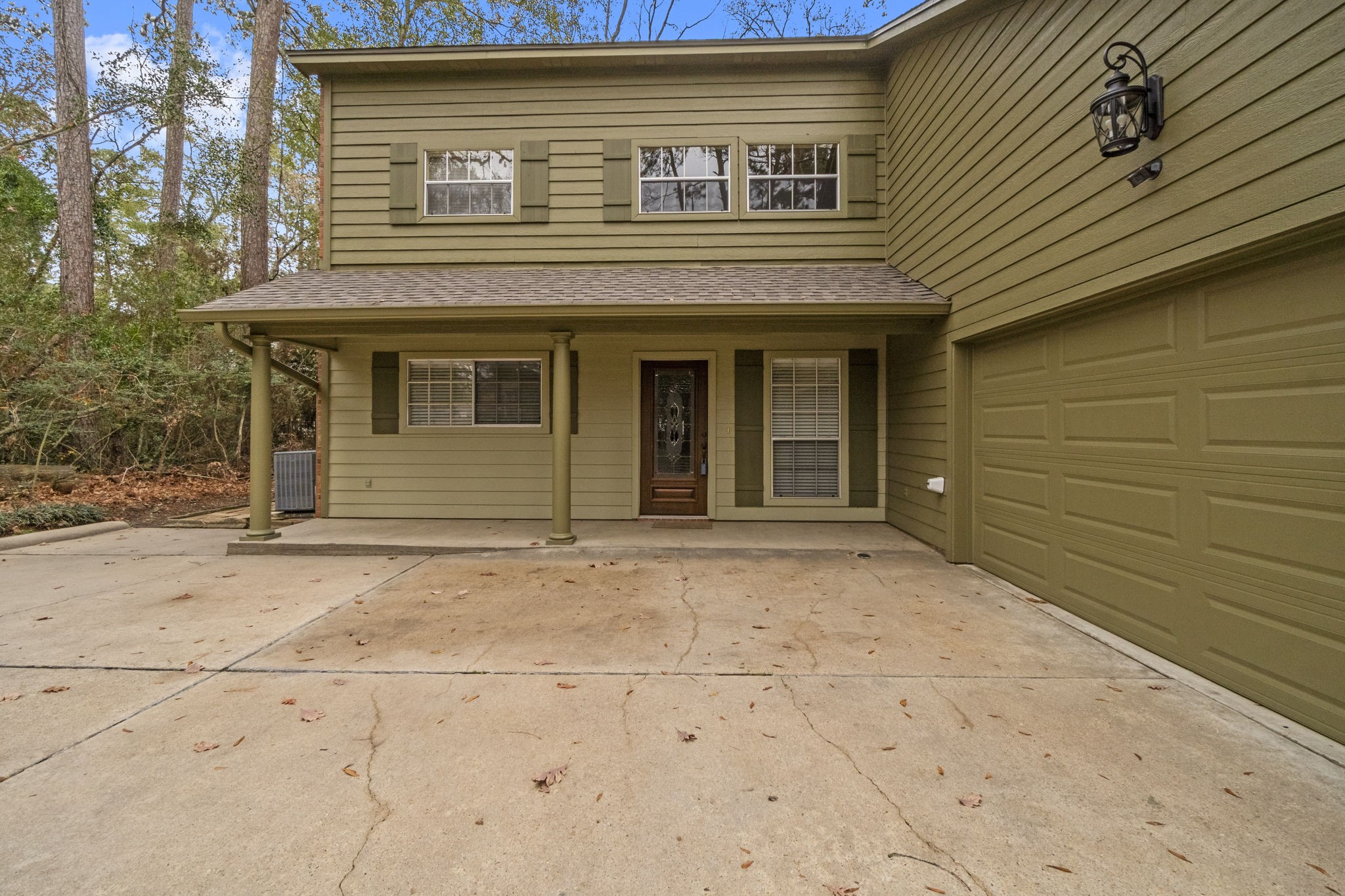 292 Apple Valley Drive Conroe, TX 77304 - Photo 4 of 40 a view of a house with a outdoor space