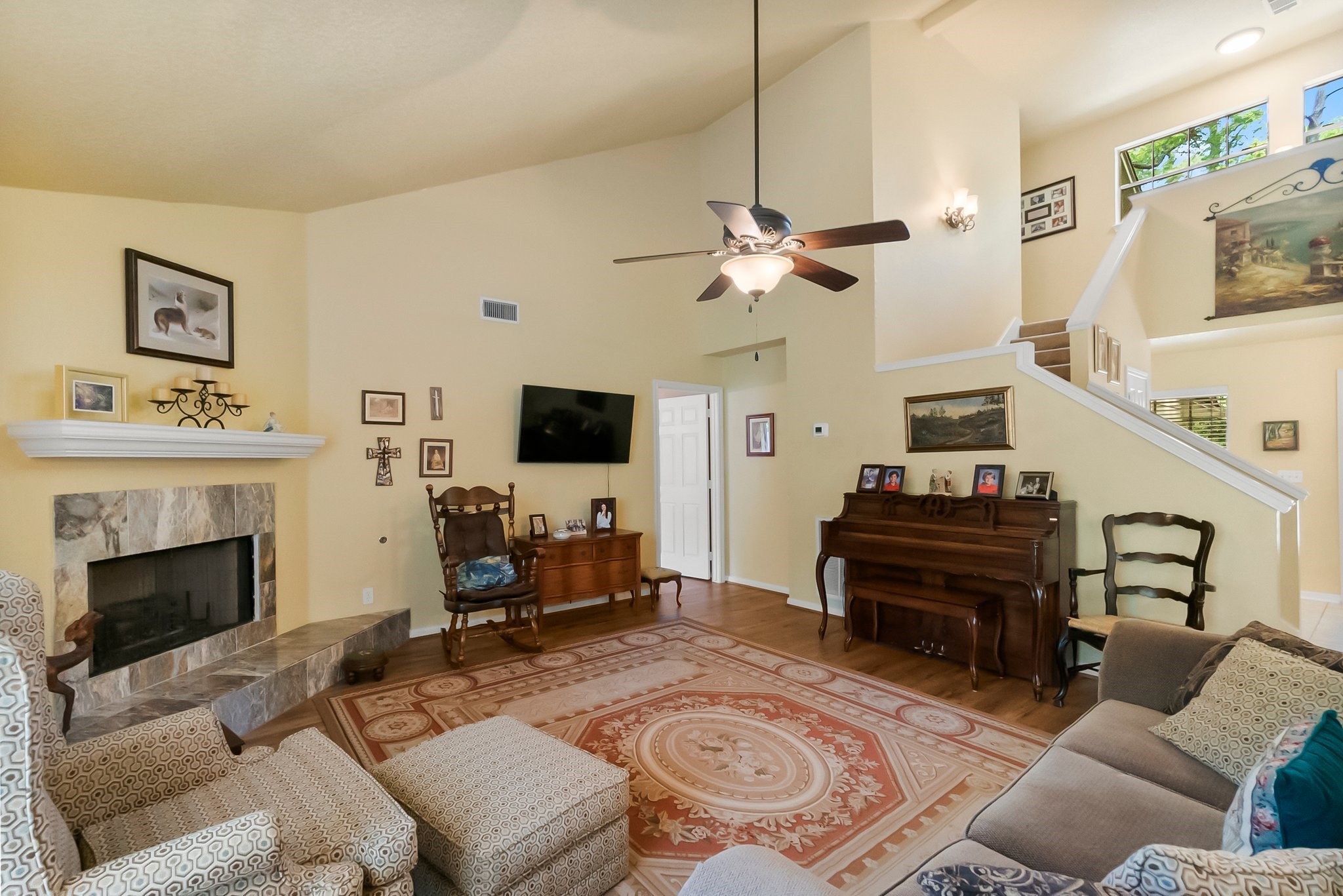 292 Apple Valley Drive Conroe, TX 77304 - Photo 8 of 40 a living room with furniture a fireplace and a flat screen tv