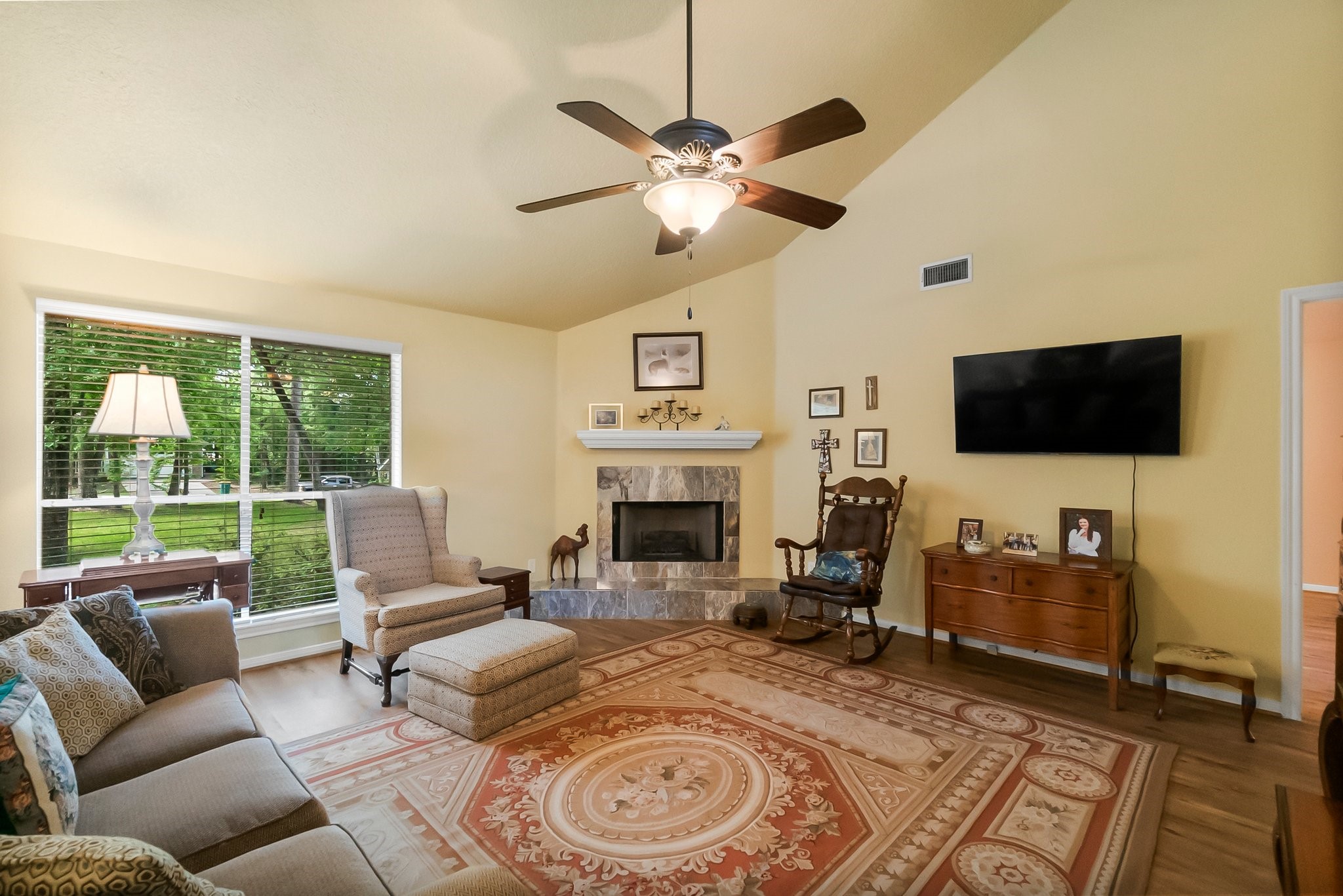 292 Apple Valley Drive Conroe, TX 77304 - Photo 9 of 40 a living room with furniture and a flat screen tv