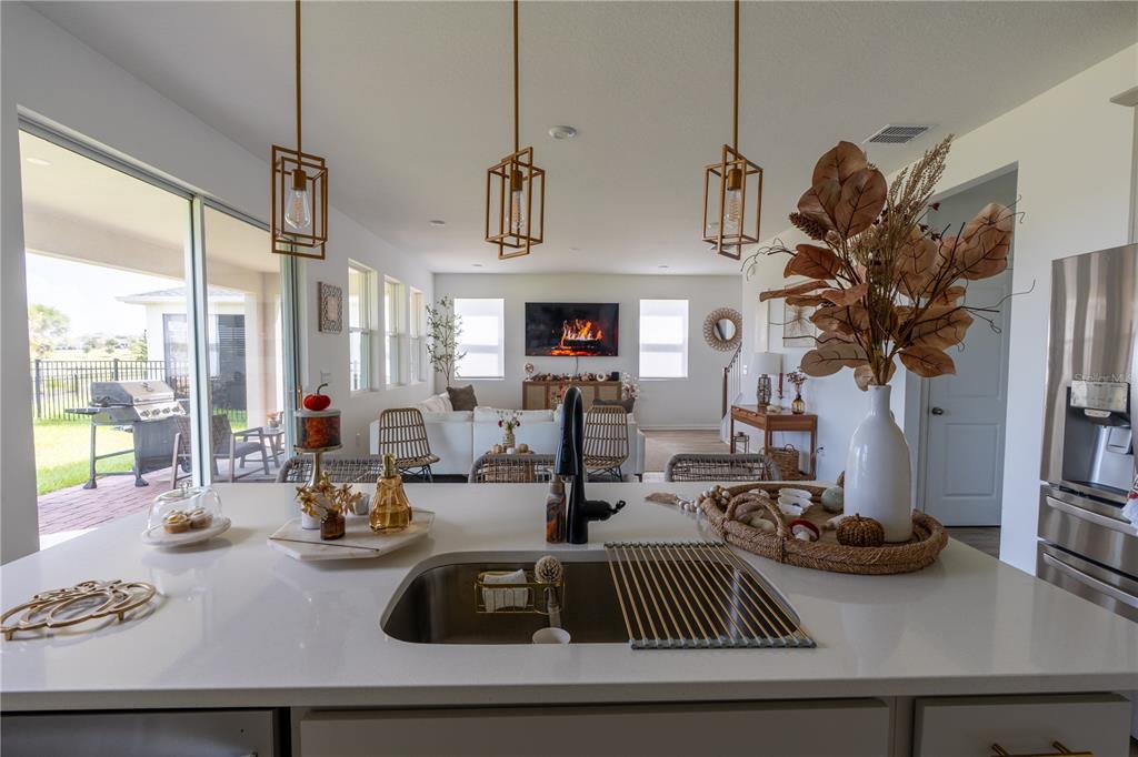 2069 Valencia Blossom Street Clermont, FL 34711 - Photo 5 of 24 a view of a livingroom with furniture and floor to ceiling window