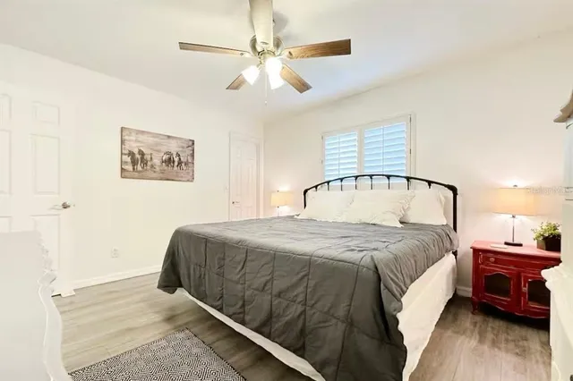 a bedroom with a bed and a closet