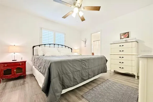a bathroom with a shower curtain and a window
