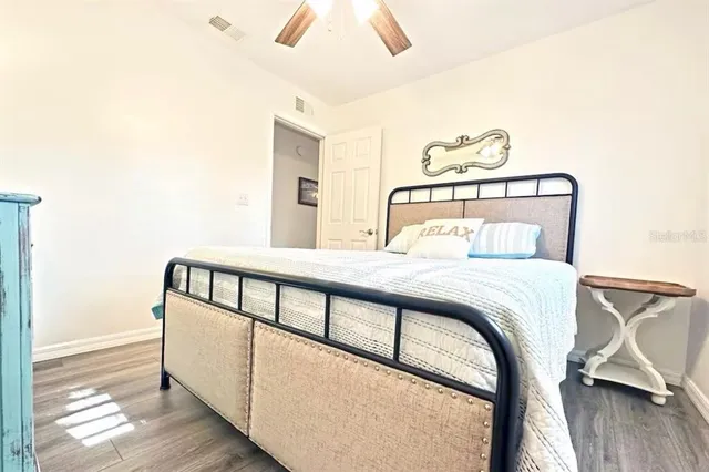 a bedroom with a bed and a dresser