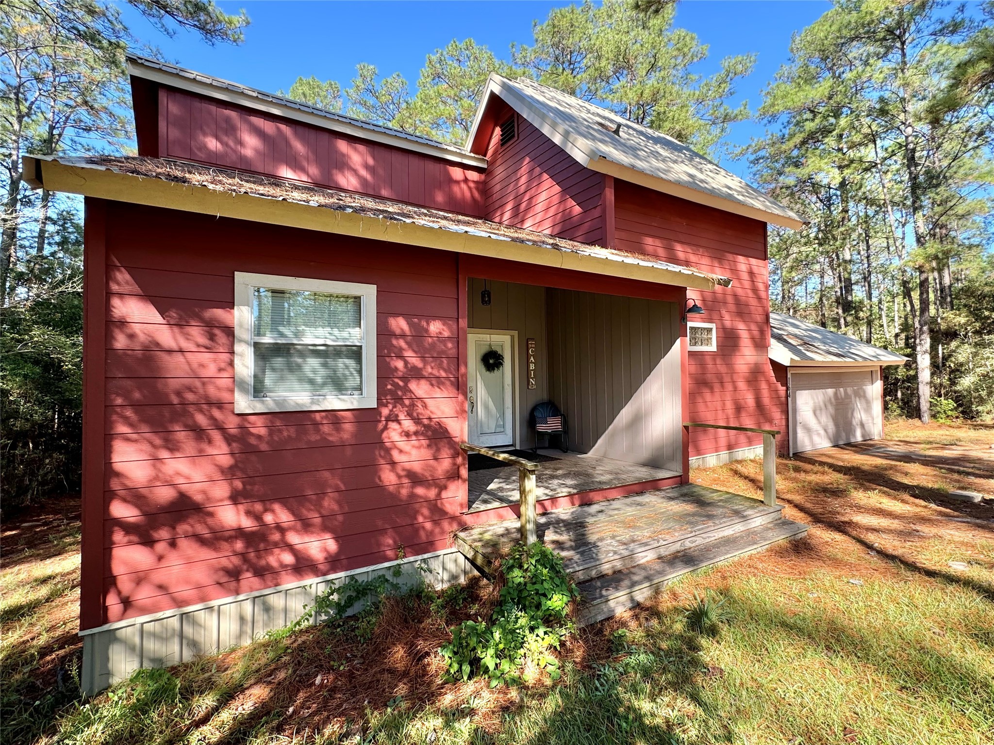 164 Pine Hollow Cove Brookeland, TX 75931 - Photo 5 of 38 a view of a house with a patio