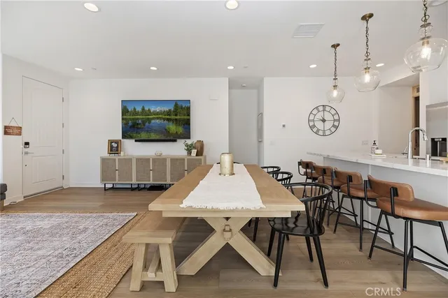 a very nice looking dining room with a table and chairs