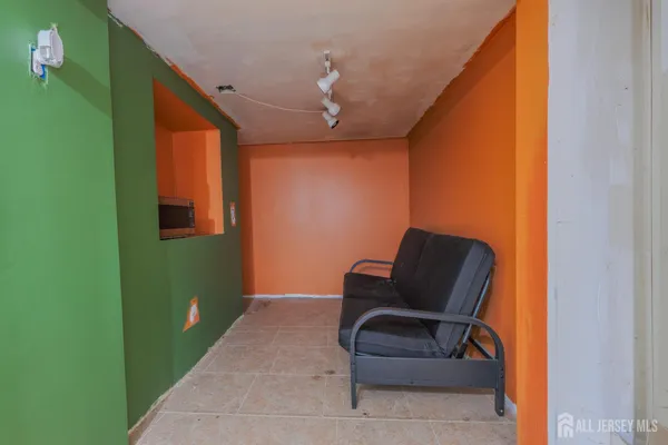 a living room with furniture and a chair