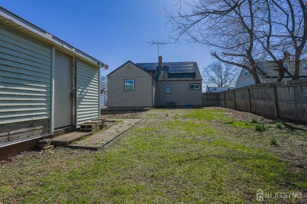 a view of a backyard of the house