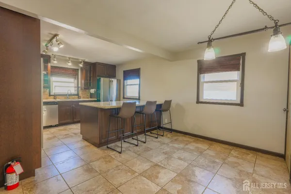 a view of a dining room with furniture and window