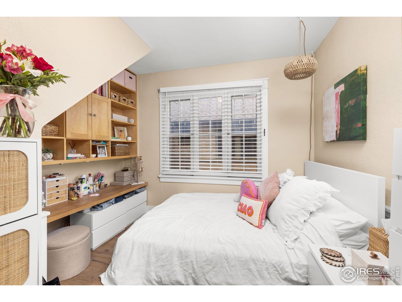 830 15th Street Boulder, CO 80302 - Photo 14 of 40 a bedroom with a bed dresser and a window