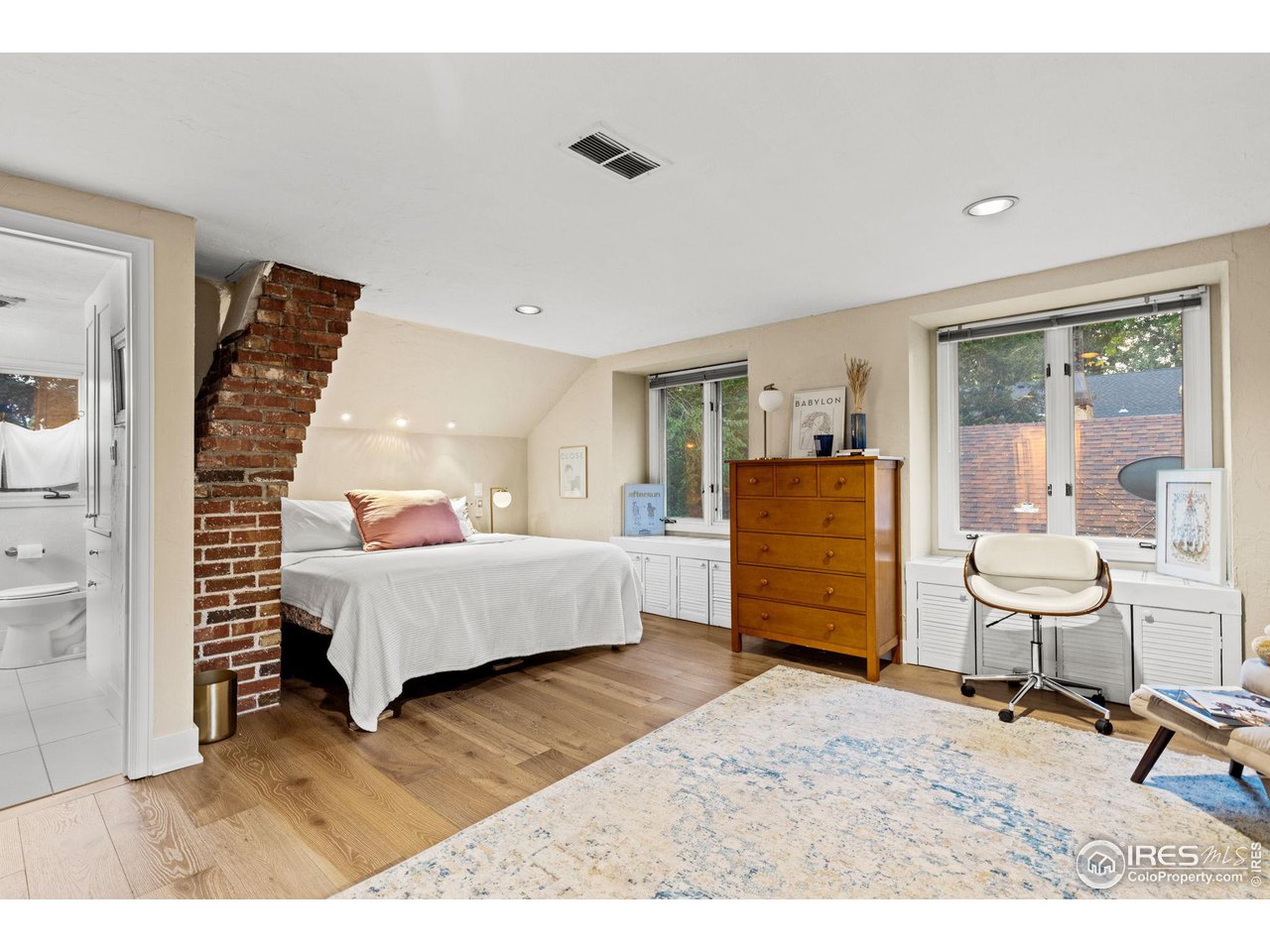 830 15th Street Boulder, CO 80302 - Photo 18 of 40 a living room with furniture and a wooden floor