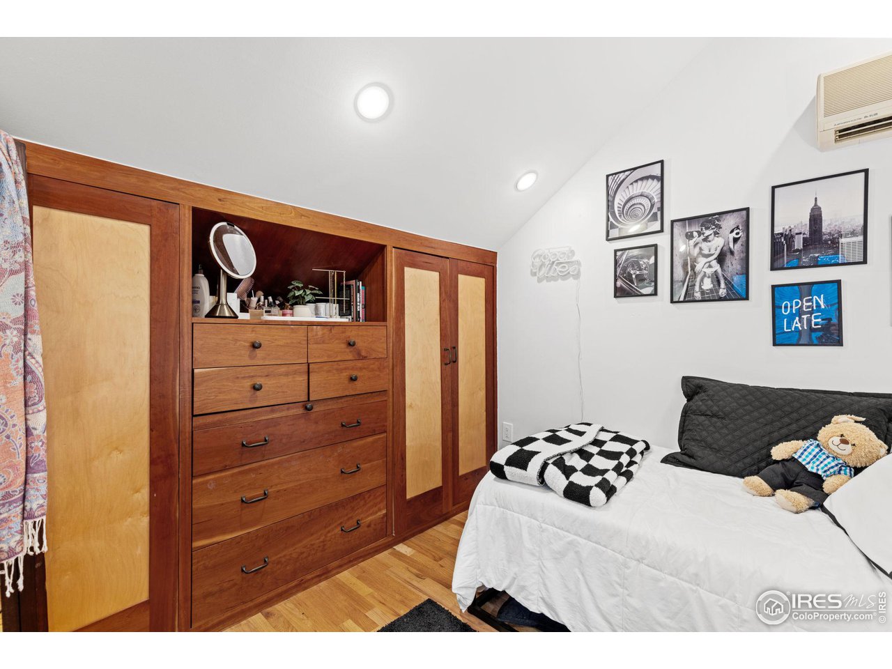 830 15th Street Boulder, CO 80302 - Photo 21 of 40 a bedroom with a bed and a dresser