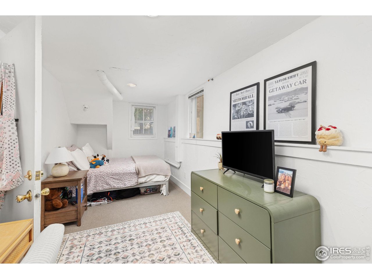 830 15th Street Boulder, CO 80302 - Photo 23 of 40 a bedroom with furniture and a flat screen tv