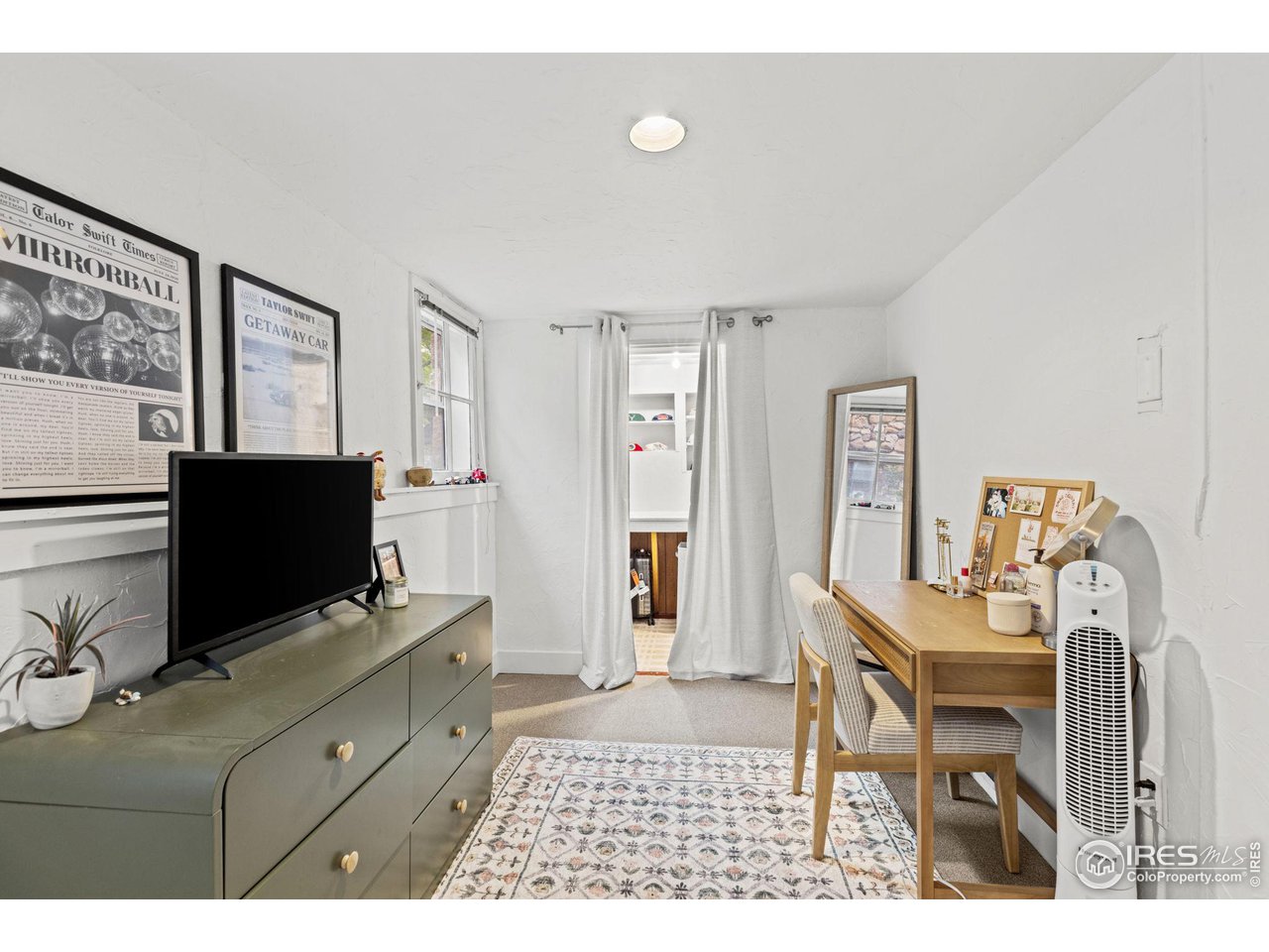 830 15th Street Boulder, CO 80302 - Photo 24 of 40 a living room with furniture and a flat screen tv