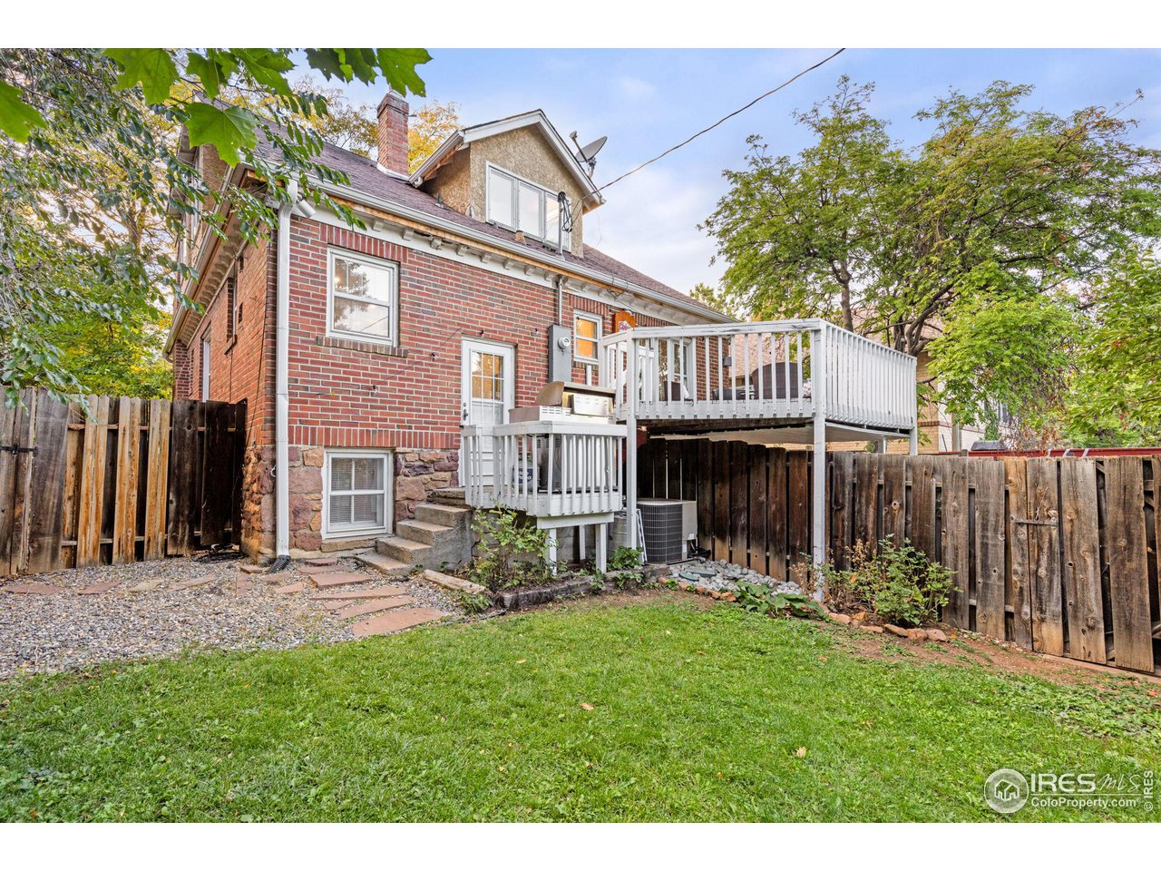 830 15th Street Boulder, CO 80302 - Photo 26 of 40 a view of a house with a yard and sitting area
