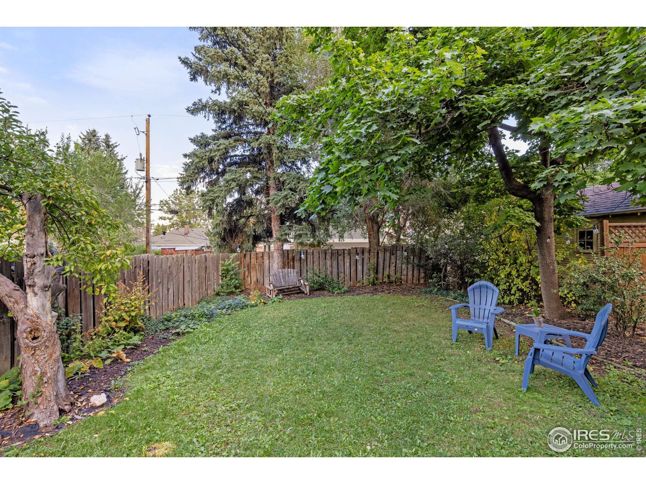 830 15th Street Boulder, CO 80302 - Photo 29 of 40 a garden with trees in front of it