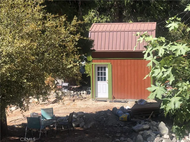 a sign that is sitting in front of a house