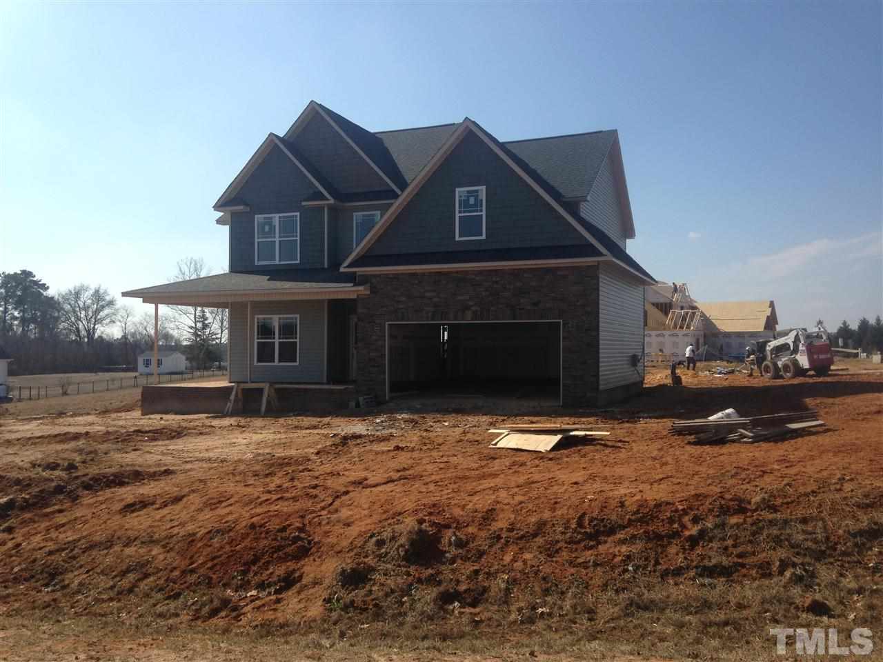 50 South Sunset Ridge Drive Willow Spring, NC 27592 - Photo 1 of 5 a front view of a house with a yard