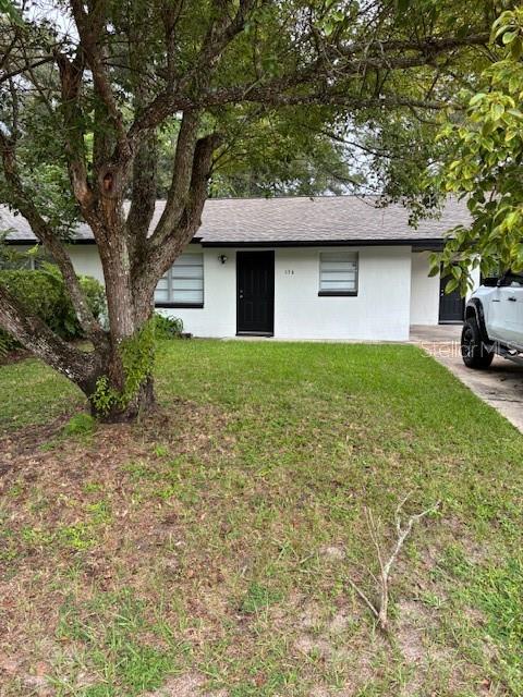 134 East Kicklighter Road Lake Helen, FL 32744 - Photo 3 of 15 a front view of a house with yard and trees
