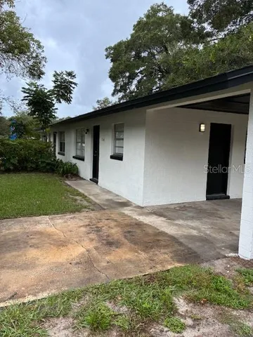 a backyard of a house with lots of green space