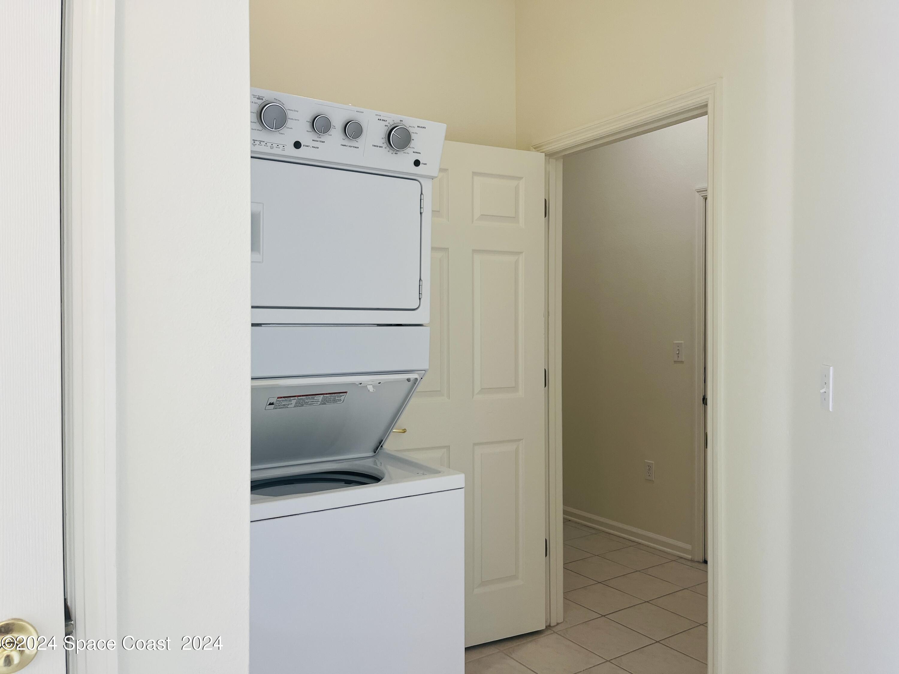 4006 Meander Place, Unit 201 Rockledge, FL 32955 - Photo 15 of 20 a utility room with dryer and washer