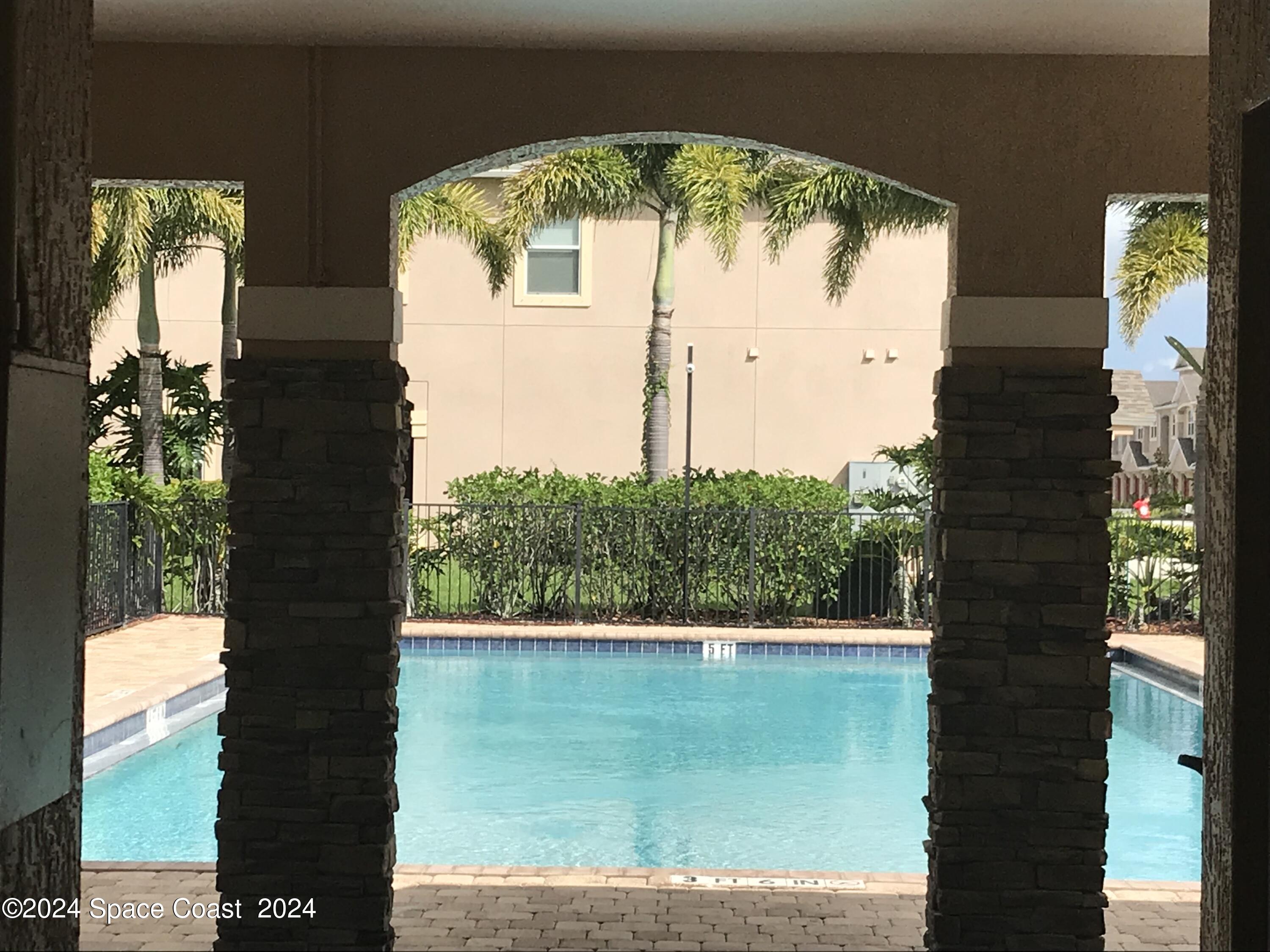 4006 Meander Place, Unit 201 Rockledge, FL 32955 - Photo 19 of 20 a view of a lake from a balcony