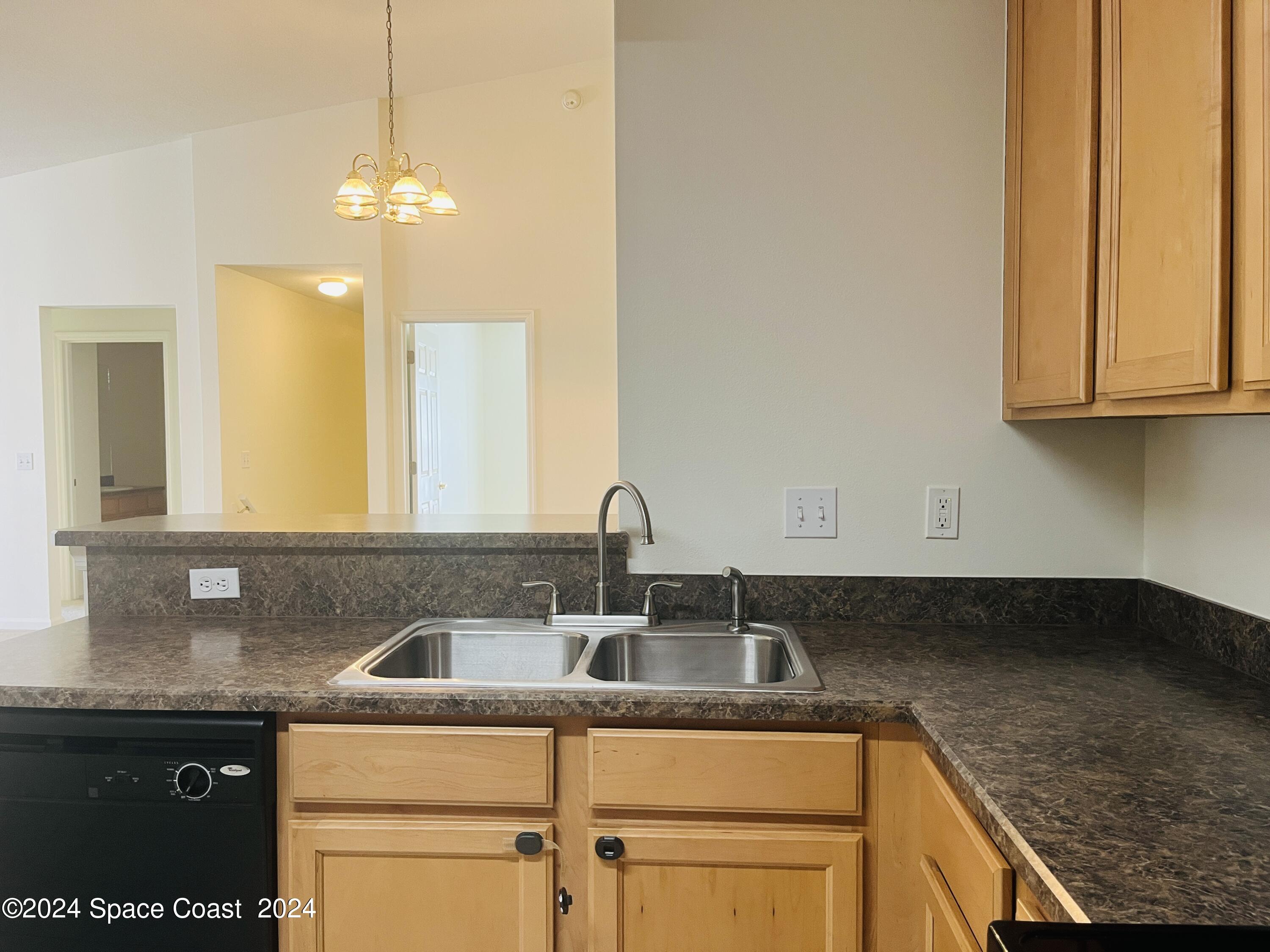 4006 Meander Place, Unit 201 Rockledge, FL 32955 - Photo 4 of 20 a kitchen with a sink and cabinets