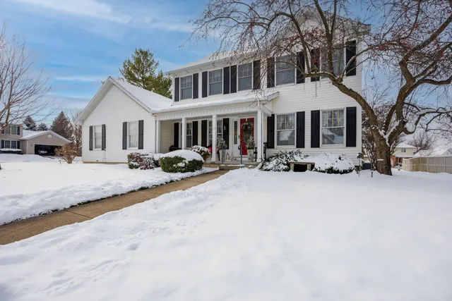a front view of a house with large yard