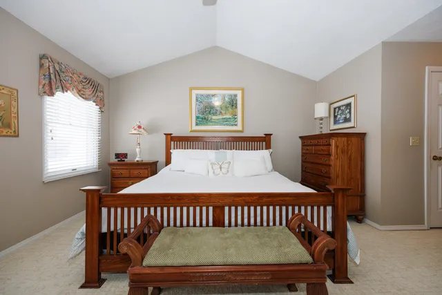 a bedroom with furniture window and wooden floor