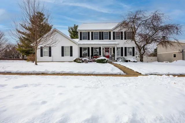 a front view of a house with yard