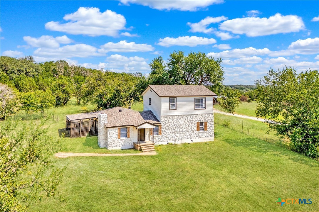 4978 Sparta Road Belton, TX 76513 - Photo 1 of 32 a aerial view of a house with a yard table and chairs