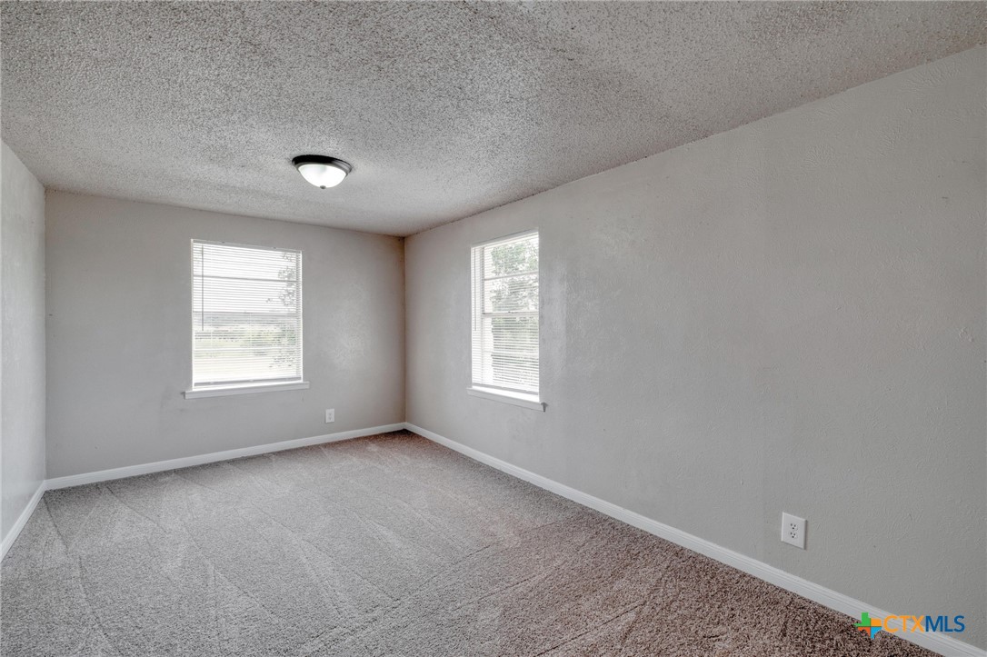 4978 Sparta Road Belton, TX 76513 - Photo 15 of 32 a view of an empty room with a window