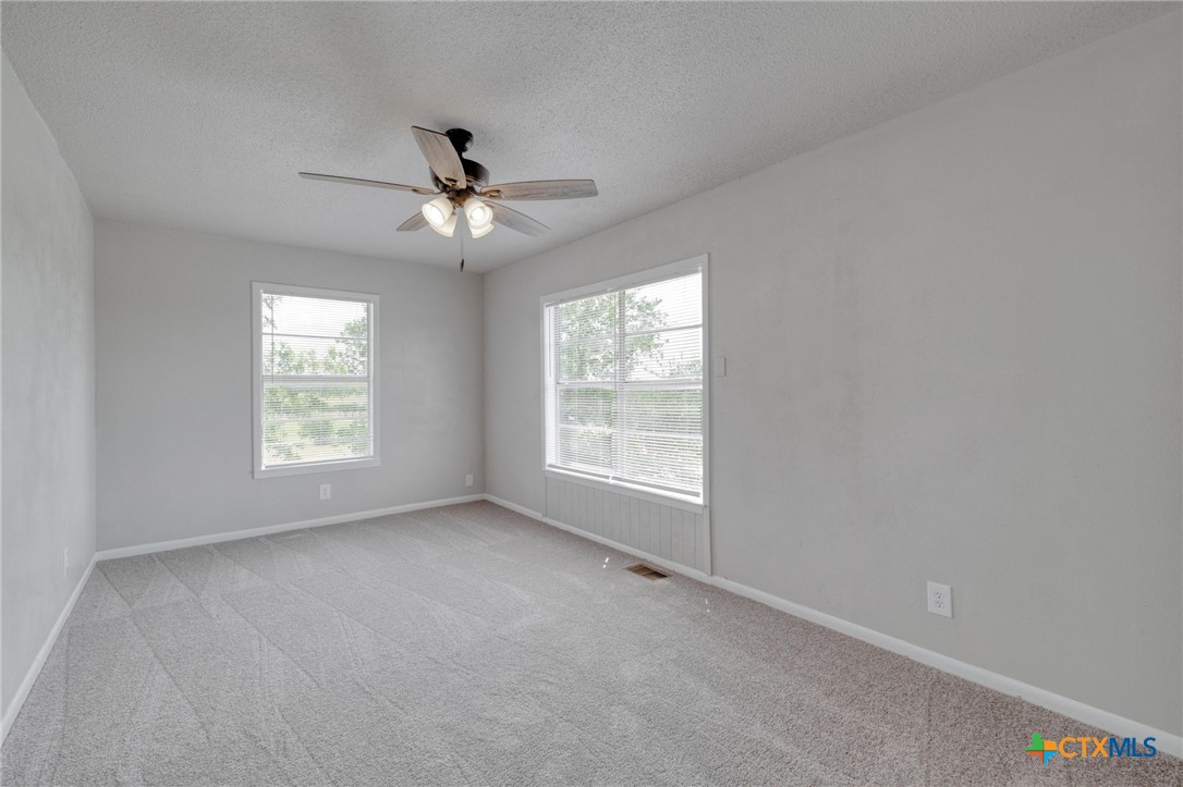4978 Sparta Road Belton, TX 76513 - Photo 18 of 32 a view of room with a ceiling fan and window