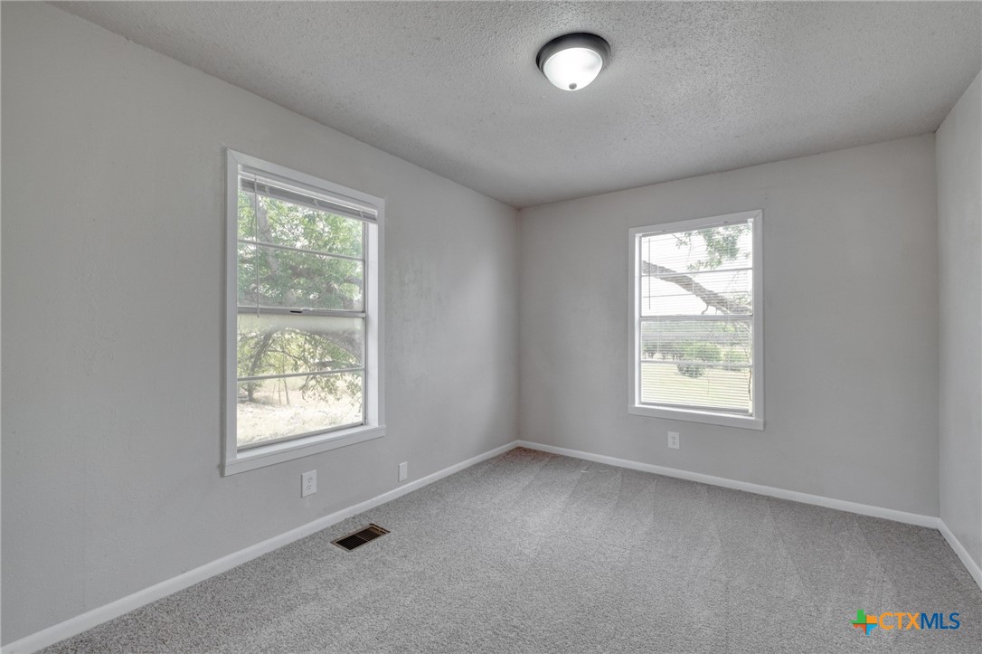 4978 Sparta Road Belton, TX 76513 - Photo 20 of 32 an empty room with windows