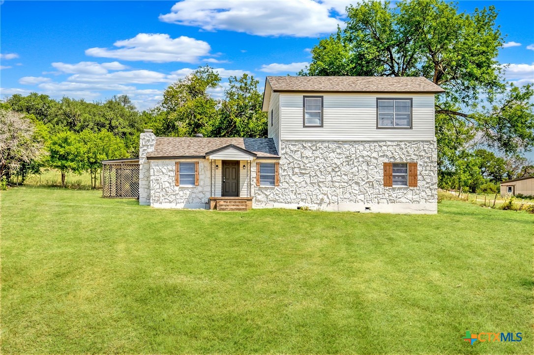 4978 Sparta Road Belton, TX 76513 - Photo 3 of 32 a front view of a house with a garden