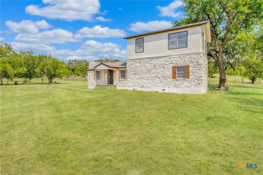4978 Sparta Road Belton, TX 76513 - Photo 4 of 32 a front view of a house with a garden