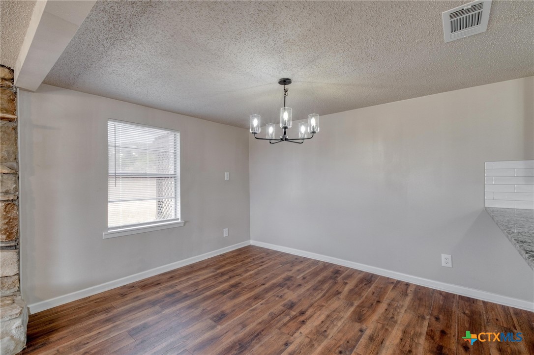 4978 Sparta Road Belton, TX 76513 - Photo 9 of 32 wooden floor in an empty room with a window