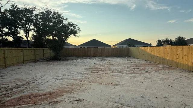 a view of wooden fence and a lake view