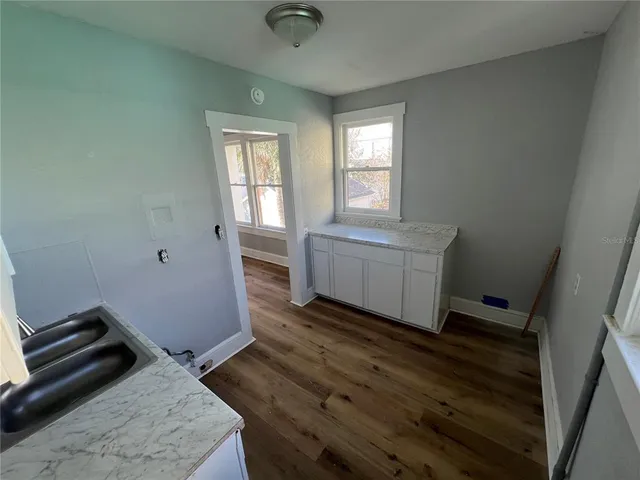 a bathroom with a sink a toilet and bathtub