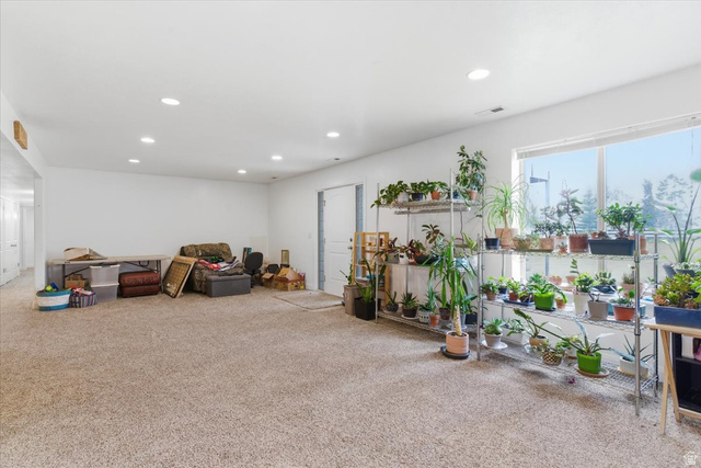 6237 West 4600th Street South Hooper, UT 84315 - Photo 34 of 48 Living area with light carpet and recessed lighting