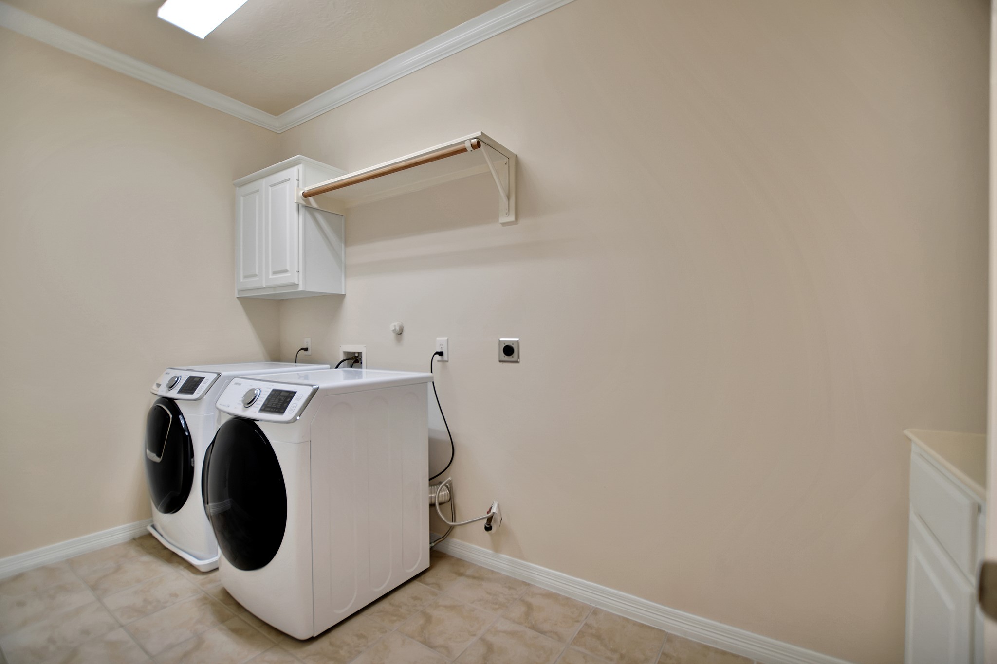 14459 Basalt Lane Houston, TX 77077 - Photo 22 of 35 Laundry area with lots of space and counter with drawers and extra storage