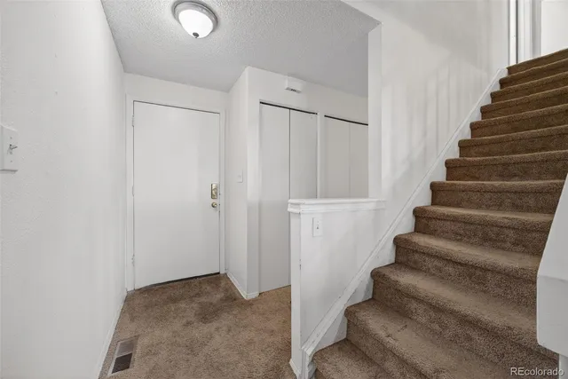 a view of staircase with white walls