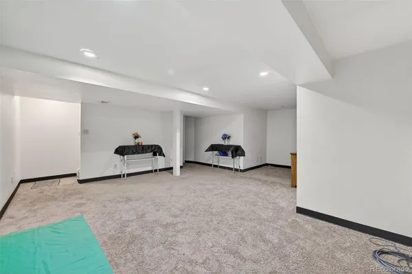 a view of a room with gym equipment and a window