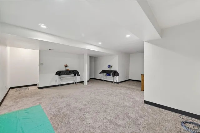 a view of a room with gym equipment and a window