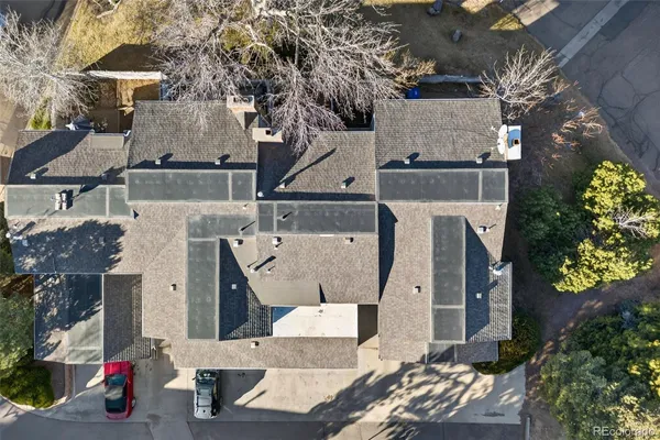 an aerial view of a house with a yard