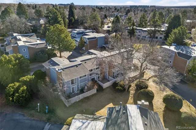 an aerial view of a house with a lake view